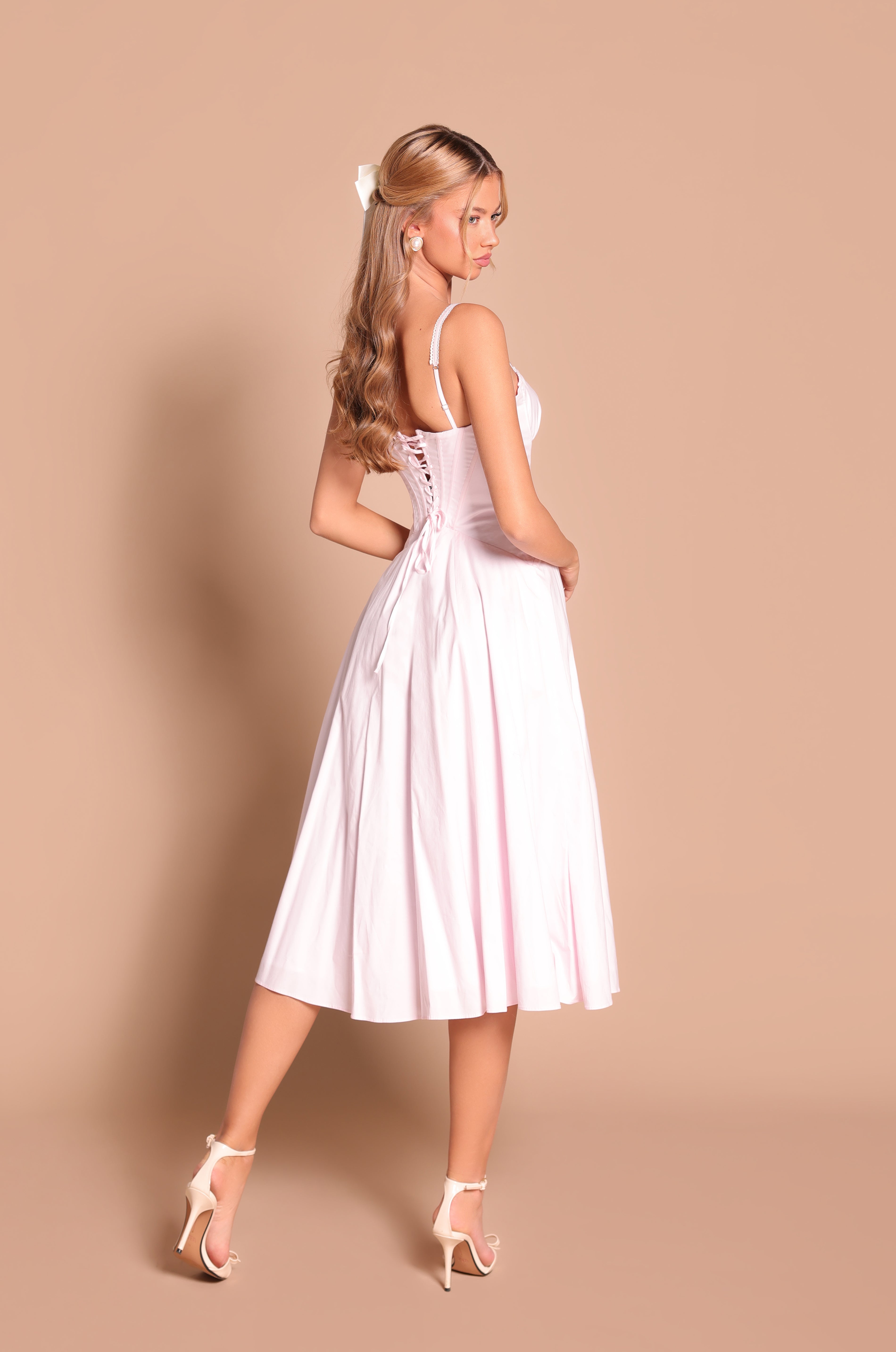 Primrose pink corset midi dress with sweetheart neckline